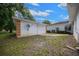 A spacious backyard with a storage shed and a well-maintained lawn under a partly cloudy sky at 10337 Sw 74Th Ter, Ocala, FL 34476