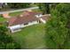Expansive backyard with a screened in porch and white picket fence, perfect for outdoor living at 10337 Sw 74Th Ter, Ocala, FL 34476
