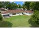 Expansive backyard with a screened in porch and white picket fence, perfect for outdoor living at 10337 Sw 74Th Ter, Ocala, FL 34476