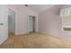 Bedroom with carpet flooring, featuring a window and spacious closet at 10337 Sw 74Th Ter, Ocala, FL 34476