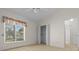 Bedroom featuring a window and closet with built-in shelving at 10337 Sw 74Th Ter, Ocala, FL 34476