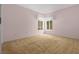 Cozy bedroom with neutral carpeting and two windows providing natural light at 10337 Sw 74Th Ter, Ocala, FL 34476