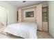 A cozy bedroom with a built-in bed and shelving unit, designed for comfort and functionality at 10337 Sw 74Th Ter, Ocala, FL 34476