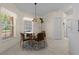 Cozy breakfast nook with a glass table, seating for four, and bright natural light at 10337 Sw 74Th Ter, Ocala, FL 34476