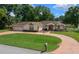 Attractive house featuring a well-kept lawn and circular driveway at 10337 Sw 74Th Ter, Ocala, FL 34476