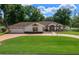 Charming single-story home with well-manicured lawn, mature trees, and inviting curb appeal at 10337 Sw 74Th Ter, Ocala, FL 34476