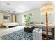 Inviting living room featuring a sofa, a rug with a geometric pattern, and plenty of natural light at 10337 Sw 74Th Ter, Ocala, FL 34476