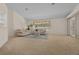 Expansive living room offers ample space, neutral decor, and plenty of natural light at 10337 Sw 74Th Ter, Ocala, FL 34476
