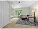 Bright living room with a sofa, rug, and a large window, creating an inviting and comfortable space at 10337 Sw 74Th Ter, Ocala, FL 34476