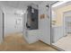 Utility room showcasing mechanical equipment, laundry hookups, and access to the kitchen at 10337 Sw 74Th Ter, Ocala, FL 34476