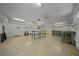 Spacious workshop features tables, shelving, and ample lighting, ready for projects and hobbies at 10337 Sw 74Th Ter, Ocala, FL 34476