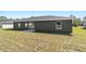 The backyard has a sliding glass door that provides access to indoor/outdoor living at 10374 Se 126Th Ln, Belleview, FL 34420