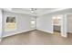 Spacious main bedroom with tray ceiling, ceiling fan, and ensuite bathroom at 10374 Se 126Th Ln, Belleview, FL 34420