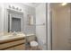 Bathroom featuring a single sink vanity and a walk-in shower at 10441 Sw 85Th Ct, Ocala, FL 34481