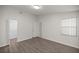 Bedroom with wood-look floors and view into the closet at 10441 Sw 85Th Ct, Ocala, FL 34481