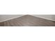 Close-up of gray wood-look laminate flooring at 10441 Sw 85Th Ct, Ocala, FL 34481