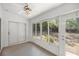 Light-filled sun room with large windows and sliding glass door to the backyard at 10441 Sw 85Th Ct, Ocala, FL 34481