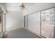 Sun room with large windows and view of the living room through sliding glass doors at 10441 Sw 85Th Ct, Ocala, FL 34481