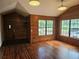 Spacious living room with hardwood floors, featuring large windows and natural lighting, perfect for comfort and style at 1047 Ne 19Th St, Ocala, FL 34470