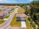 Aerial view of the property featuring a corner lot, fenced backyard, and proximity to wooded areas at 11136 Se 69Th Ter, Belleview, FL 34420
