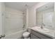 Bright bathroom features a shower and vanity at 11136 Se 69Th Ter, Belleview, FL 34420