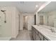 Bathroom boasts double sinks, large mirror and shower at 11136 Se 69Th Ter, Belleview, FL 34420