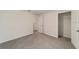 Bedroom boasts gray carpeting, ample closet space, and neutral tones at 11136 Se 69Th Ter, Belleview, FL 34420