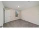 Bedroom featuring gray carpet and a window for natural light at 11136 Se 69Th Ter, Belleview, FL 34420