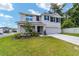 Charming two-story home with a well-manicured lawn, fresh landscaping, and a two-car garage at 11136 Se 69Th Ter, Belleview, FL 34420