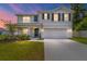 Charming two-story home with a well-manicured lawn, fresh landscaping, and a two-car garage at 11136 Se 69Th Ter, Belleview, FL 34420