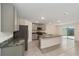 Open concept kitchen with stainless appliances, granite countertops, and tile flooring at 11136 Se 69Th Ter, Belleview, FL 34420