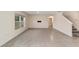 Open living room with tile flooring and natural light at 11136 Se 69Th Ter, Belleview, FL 34420