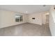 Spacious living room features tile flooring and a bright window at 11136 Se 69Th Ter, Belleview, FL 34420