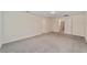 Empty carpeted room with multiple doors and neutral paint at 11136 Se 69Th Ter, Belleview, FL 34420