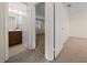 The interior view shows a cozy bathroom and a glimpse of a bedroom featuring neutral tones and soft carpeting at 1115 Silver Rd, Ocala, FL 34472