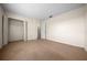 This spacious bedroom features soft carpeting and leads to a walk-in closet and bathroom at 1115 Silver Rd, Ocala, FL 34472