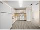 Bright kitchen with white appliances, ample cabinet space, and a clean, functional layout at 1115 Silver Rd, Ocala, FL 34472