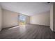 Spacious living room with neutral walls, large windows, and modern flooring for a bright interior at 1115 Silver Rd, Ocala, FL 34472