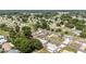 An aerial view of a residential neighborhood with lush trees and green lawns at 11153 Sw 79Th Ave, Ocala, FL 34476
