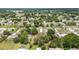 Panoramic aerial shot of a neighborhood surrounded by lush trees, showcasing a serene environment at 11153 Sw 79Th Ave, Ocala, FL 34476