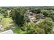 Aerial view of a neighborhood with mature trees and lush green lawns at 11153 Sw 79Th Ave, Ocala, FL 34476