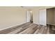 Bedroom featuring plank flooring, closet with bifold door, and neutral color scheme at 11153 Sw 79Th Ave, Ocala, FL 34476
