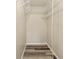 Walk-in closet with wire shelving and plank flooring for organized storage at 11153 Sw 79Th Ave, Ocala, FL 34476