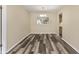 Cozy dining area with stylish flooring and a modern chandelier fixture at 11153 Sw 79Th Ave, Ocala, FL 34476