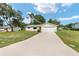 Charming single-story home features a well-maintained lawn and a long concrete driveway at 11153 Sw 79Th Ave, Ocala, FL 34476