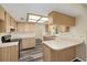 Charming kitchen with wood cabinets, updated flooring, and plenty of counter space at 11153 Sw 79Th Ave, Ocala, FL 34476