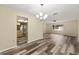 Open-concept dining and living area with neutral walls and updated flooring at 11153 Sw 79Th Ave, Ocala, FL 34476