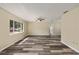 Spacious living room with new floors and natural light, perfect for relaxation and entertaining at 11153 Sw 79Th Ave, Ocala, FL 34476