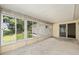 Bright sunroom with screened windows, seamlessly connecting indoor and outdoor living at 11153 Sw 79Th Ave, Ocala, FL 34476