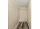 Spacious walk-in closet with wire shelving and hardwood floors, perfect for organized storage at 11153 Sw 79Th Ave, Ocala, FL 34476